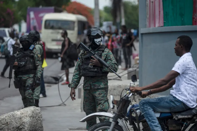 Armed militias wielding machetes clash with gangs in the streets of Port-au-Prince while Haiti’s ruling elites compete for control.